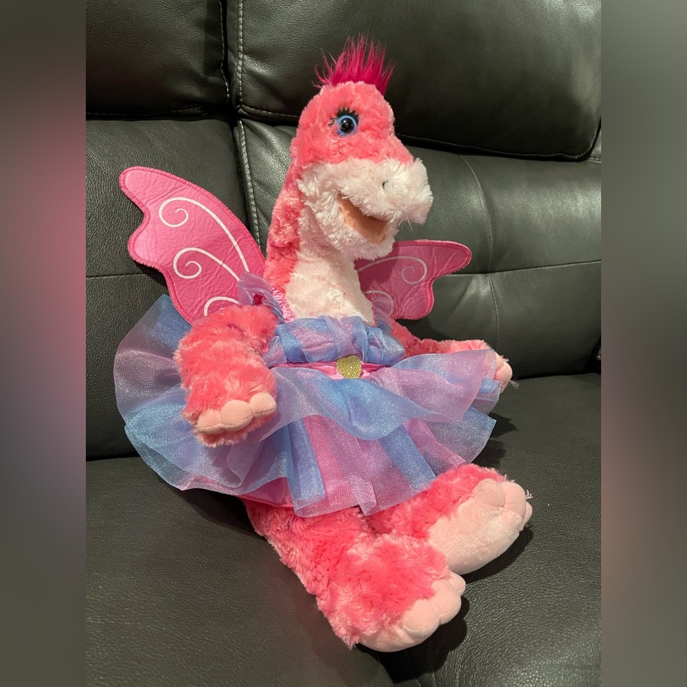 Build-A-Bear pink Apatosaurus dinosaur plush toy, dressed